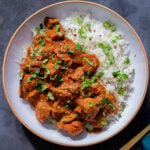 bowl of Kashmiri mushrooms, garnished with cilantro