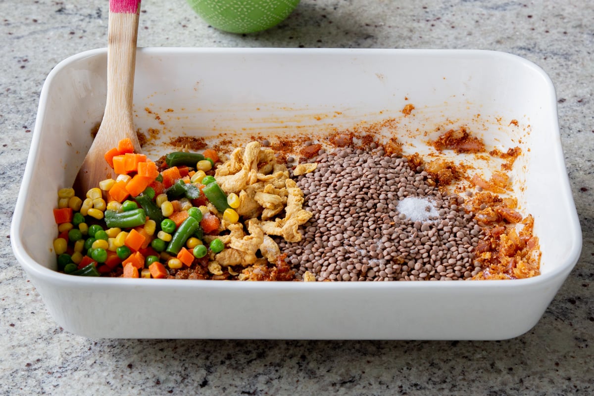 adding veggies to the pan