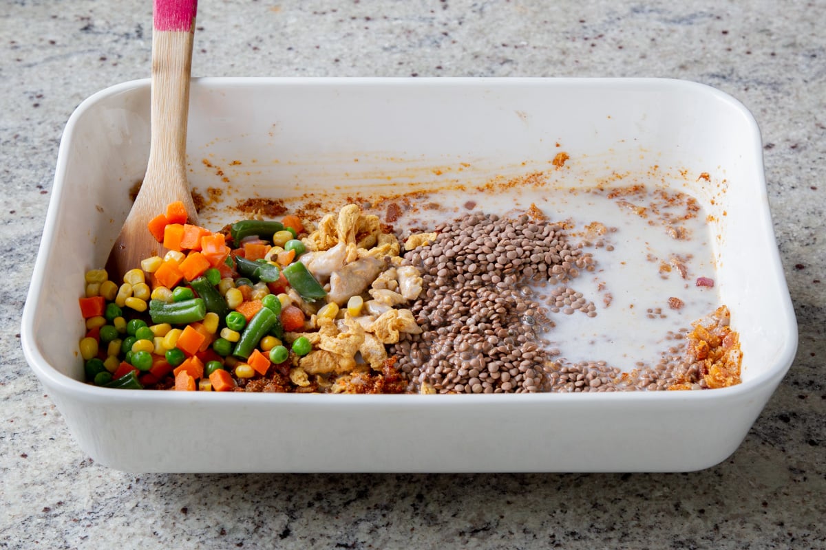 adding coconut milk to the pan