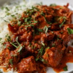 kosha mangsho on a plate with rice