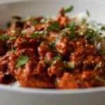 close-up of kosha mangsho on a plate with rice