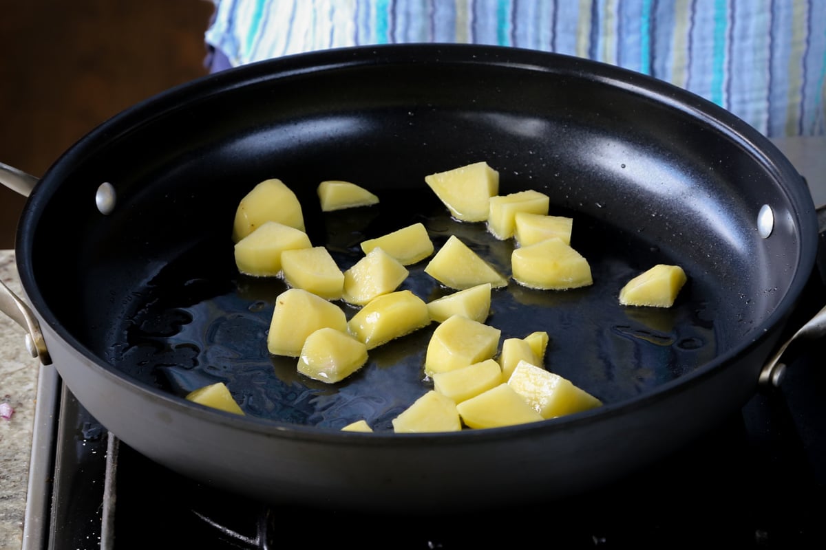 potatoes in the pan before cooking