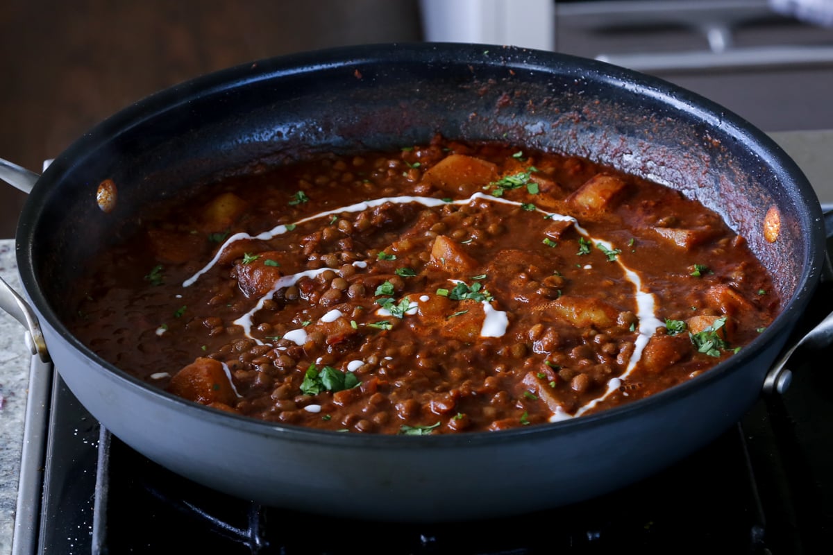 lentils vindaloo in the pan after adding the toppings