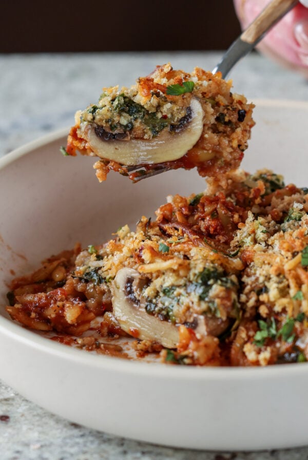 fork taking a bite of mushroom parmesan