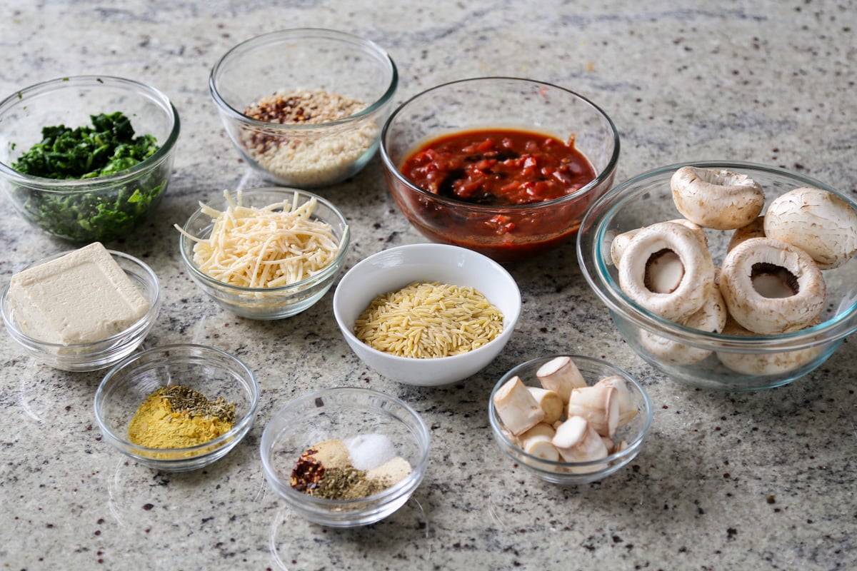 mushroom parmesan ingredients in bowls on the kitchen counter