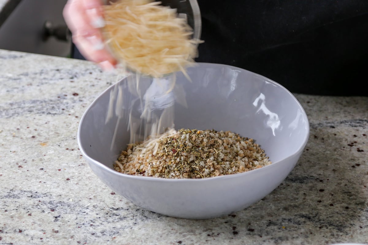 adding vegan cheese to the breadcrumb mixture