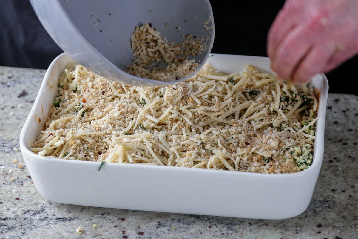 topping the mushroom parmesan with the breadcrumb mixture