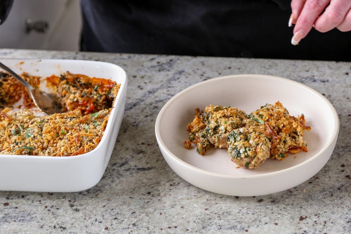 serving mushroom parmesan from the pan