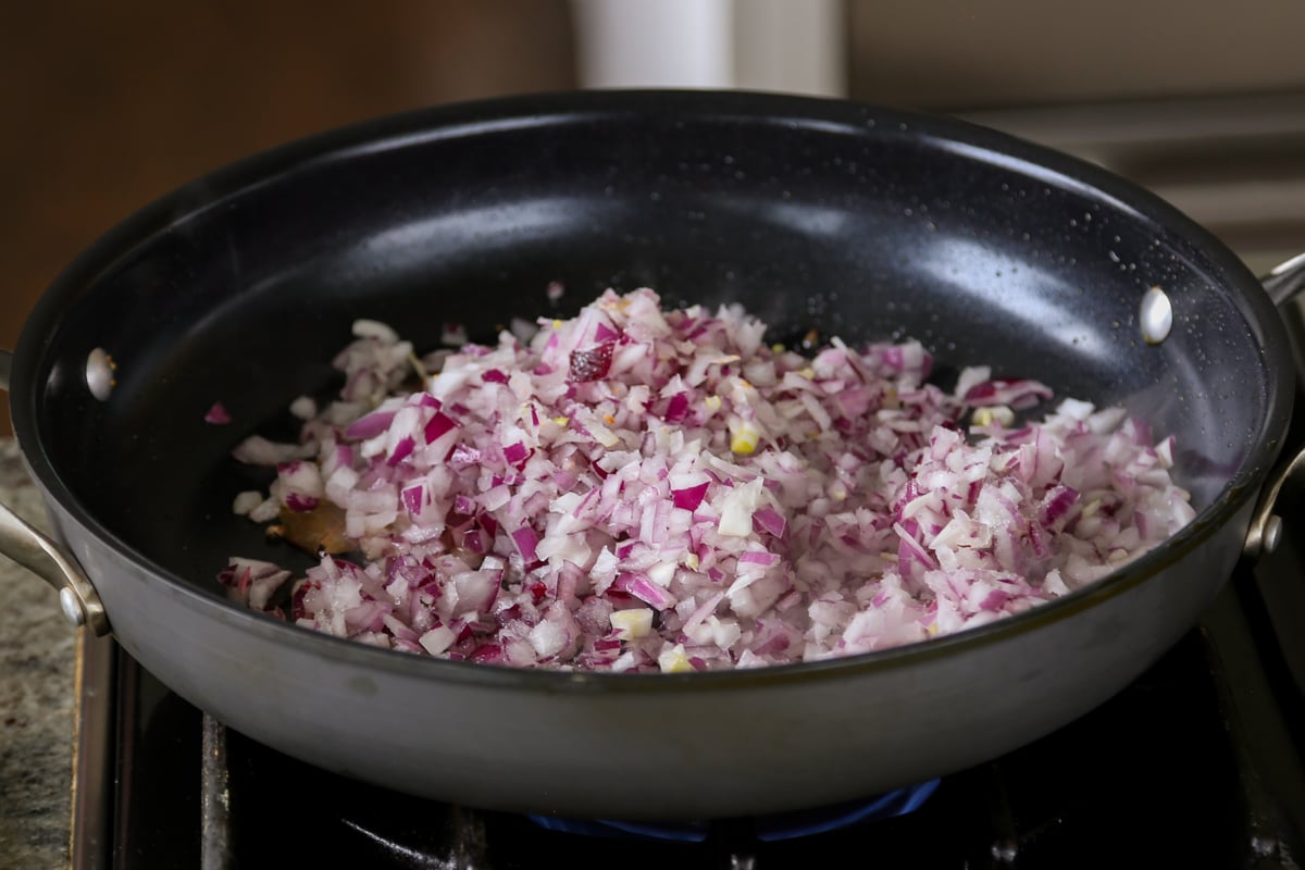 adding onion to the pan