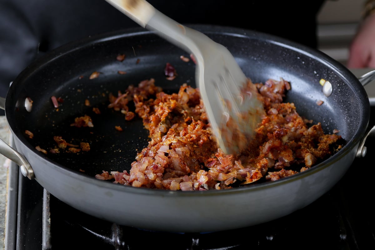 mixing ground spices into the onion