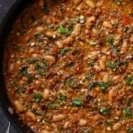 vegan sausage pasta sauce in the pan, with garnish