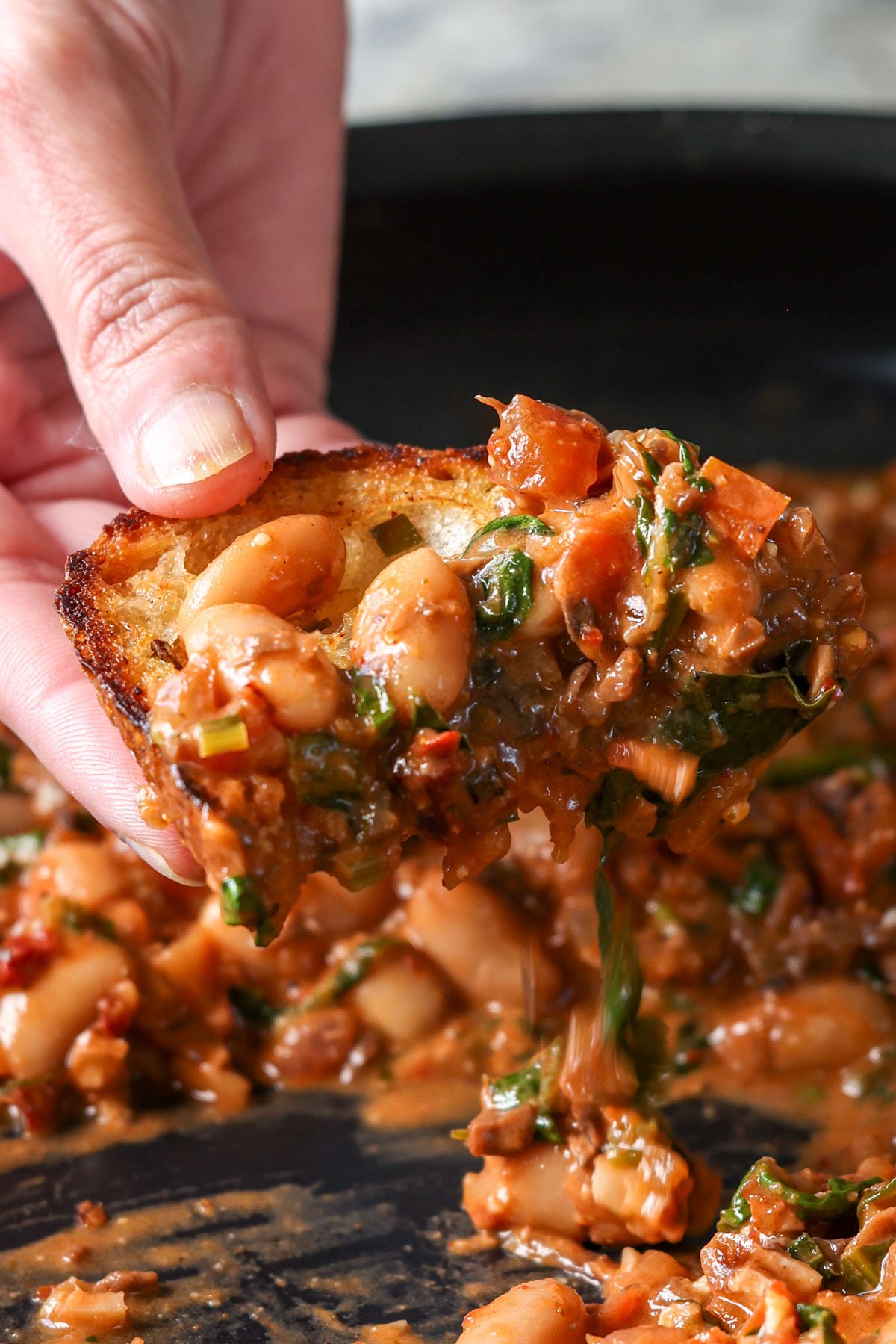 vegan sourdough covered in the sausage pasta sauce