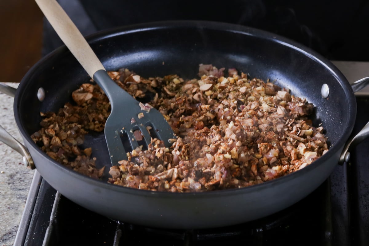 mixing the vegan sausage ingredients in the pan