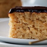 close-up of slice of peanut butter cake with chocolate peanut butter glaze