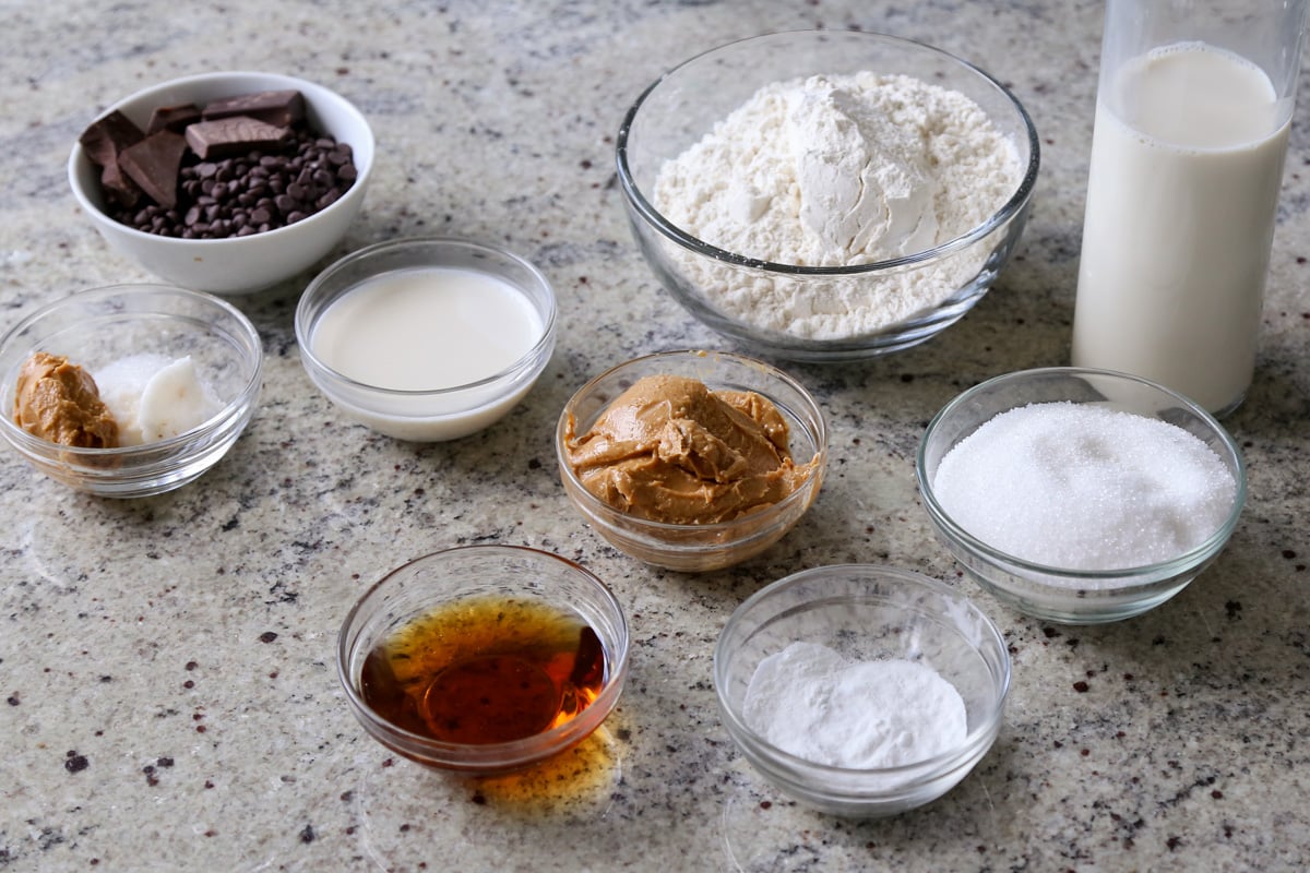 peanut butter cake ingredients in bowls on the kitchen counter