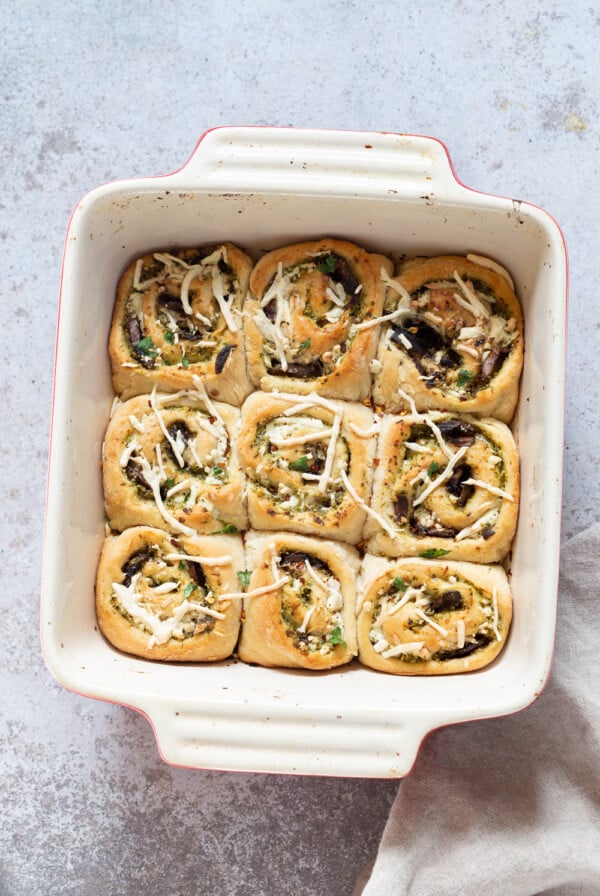 overhead shot of Pesto Pizza rolls in a white casserole dish