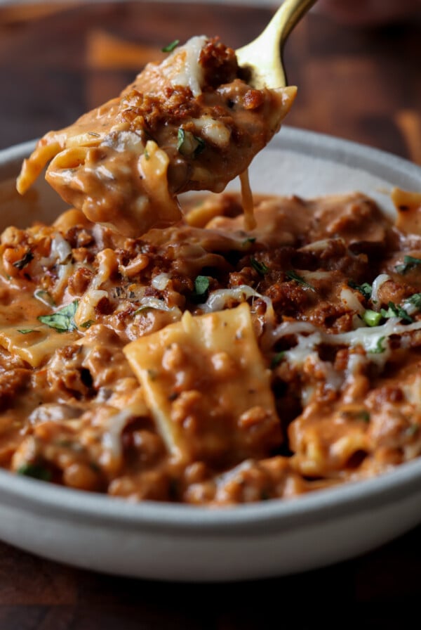 spooning a bite of creamy lasagna soup