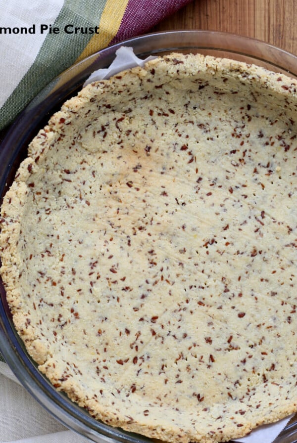 overhead shot of a vegan almond flour pie crust in a pyrex baking dish