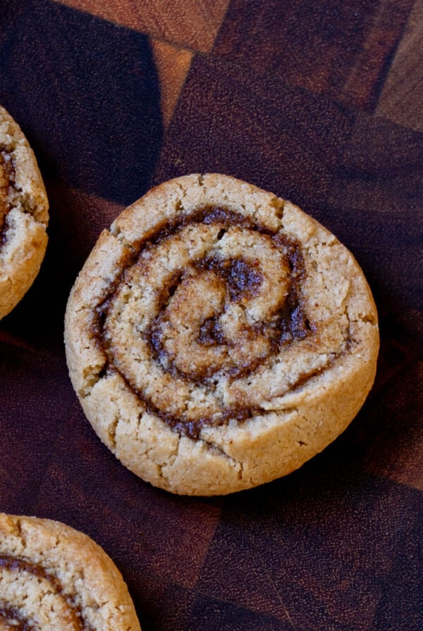 pumpkin spice roll cookies on a wooden tray