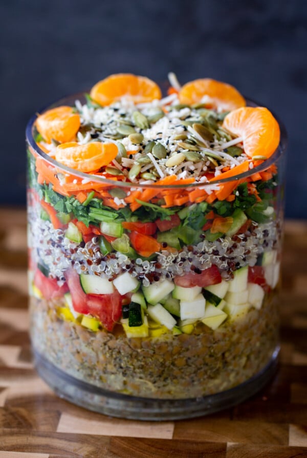 adding orange and seeds layer to the salad