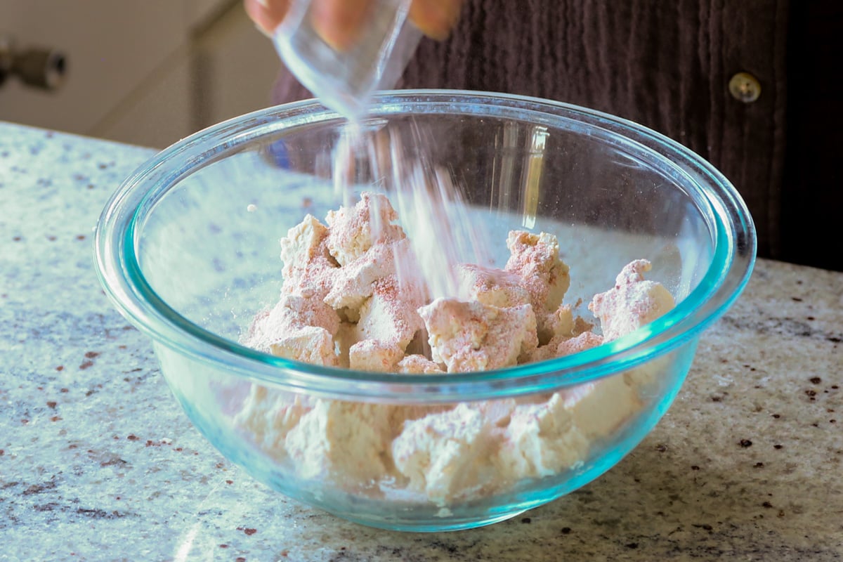 adding spices to the tofu