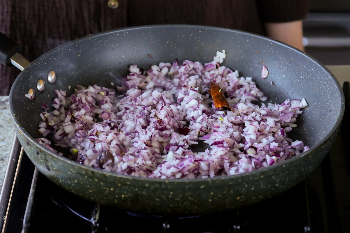 adding onion to the pan