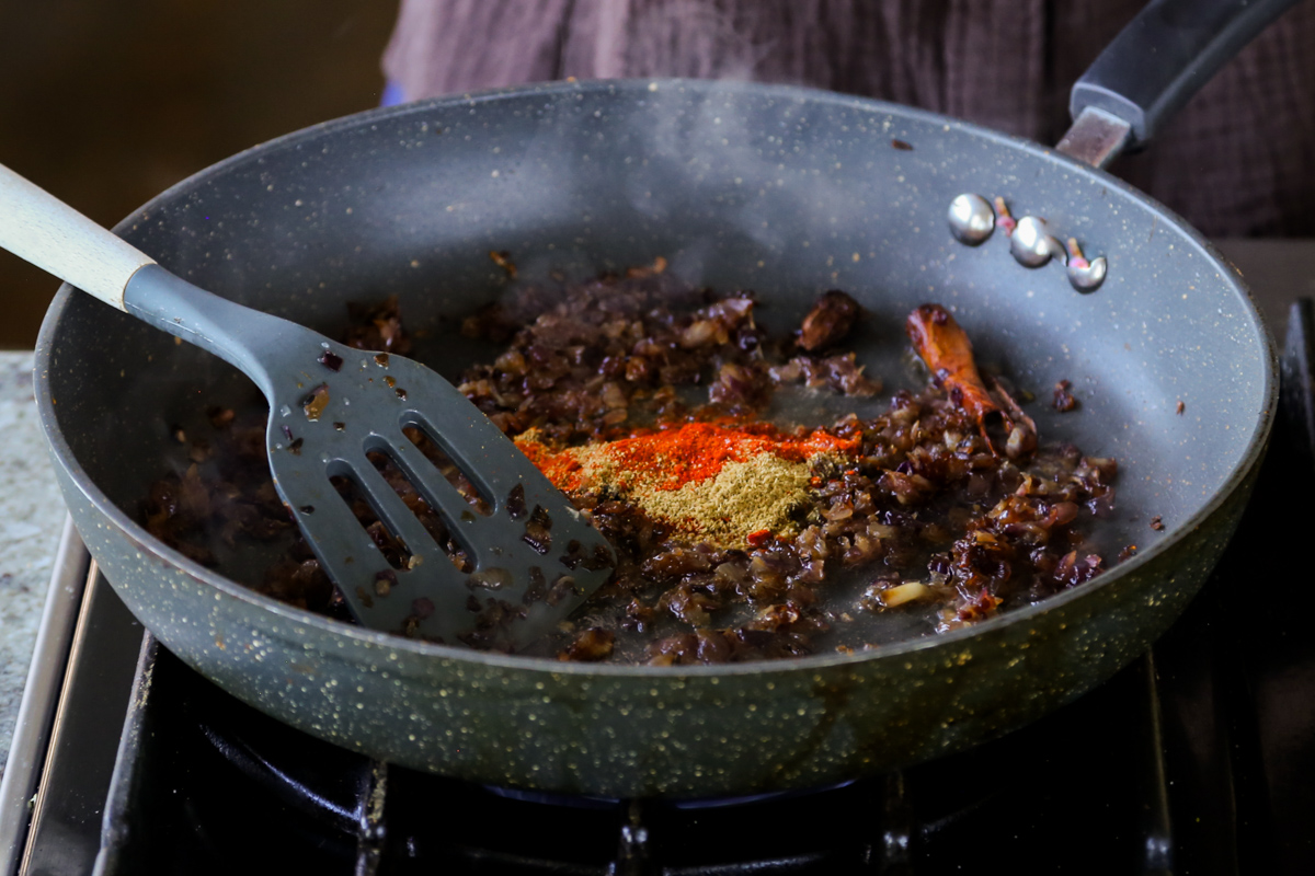 adding ground spices to the onion