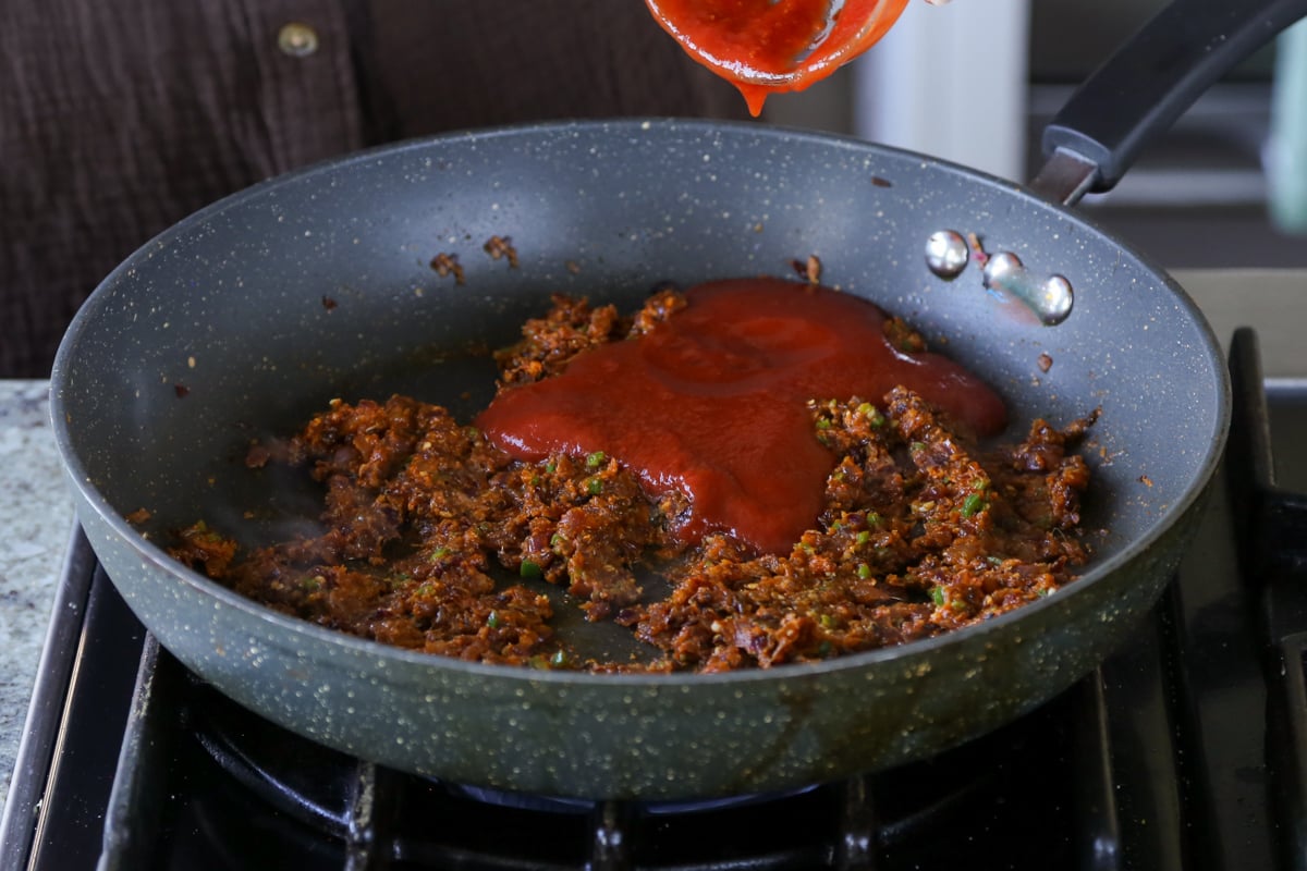 adding tomato puree