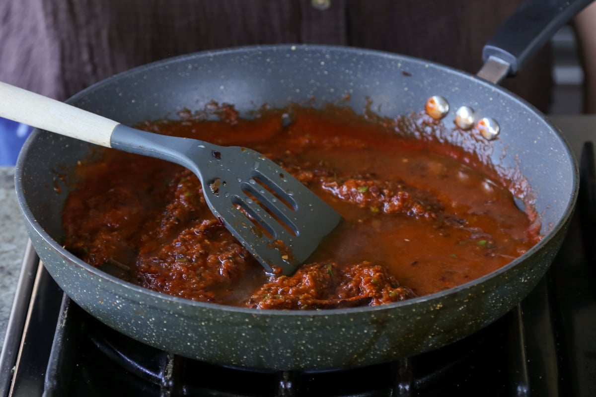 mixing in the tomato puree