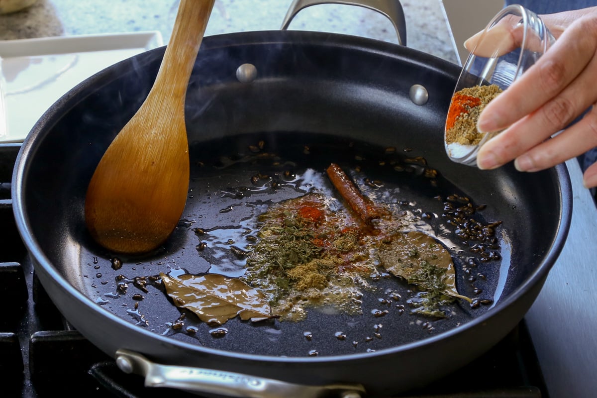 adding the remaining spices to the pan