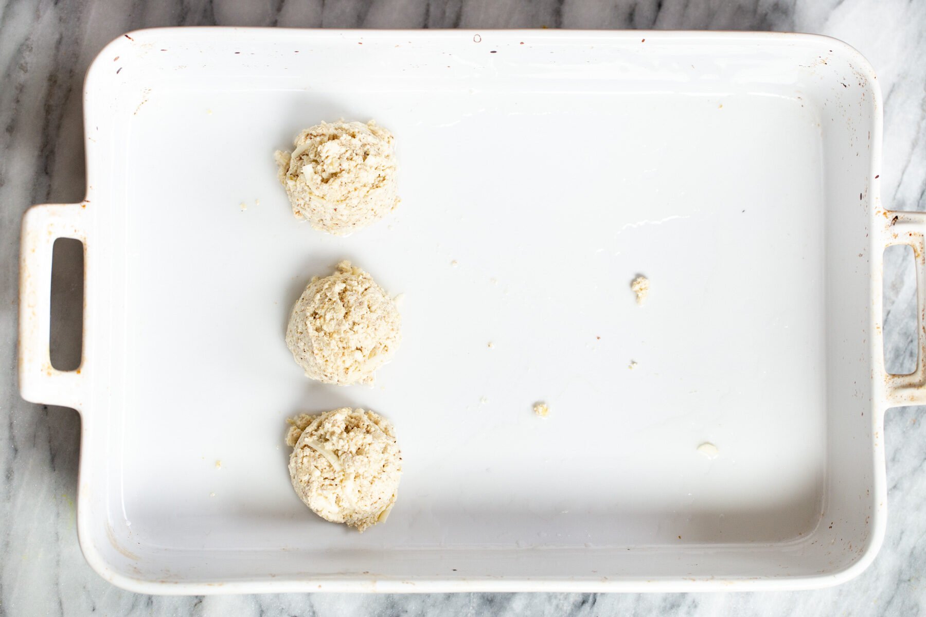 vegan tofu koftas in a white casserole dish 