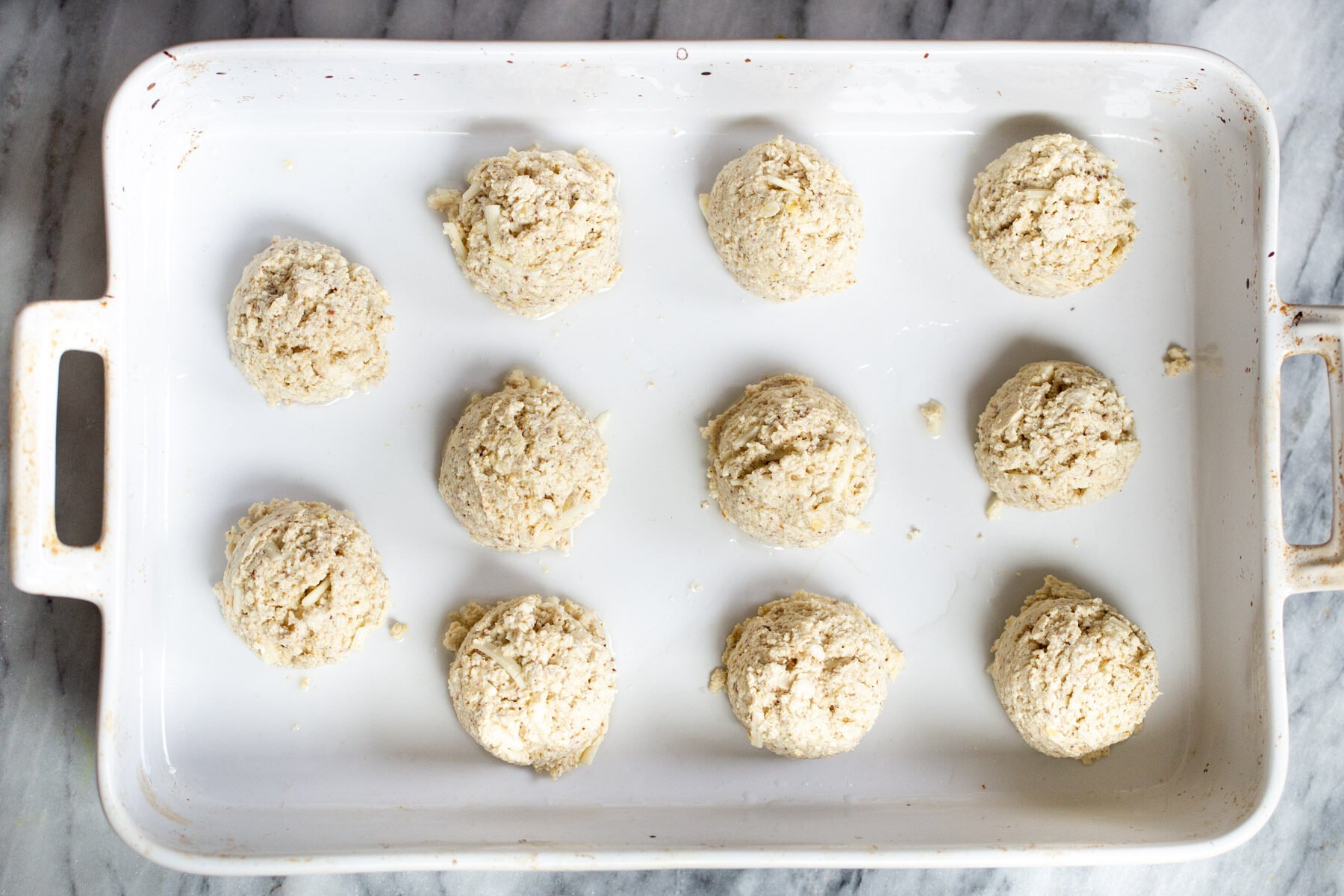 vegan tofu koftas in a white casserole dish 