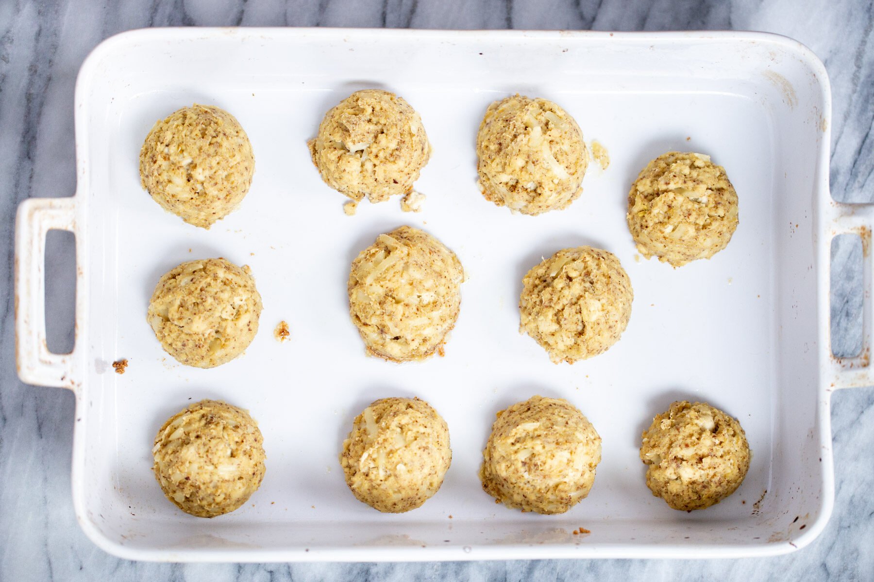 baked tofu koftas in a white casserole dish 