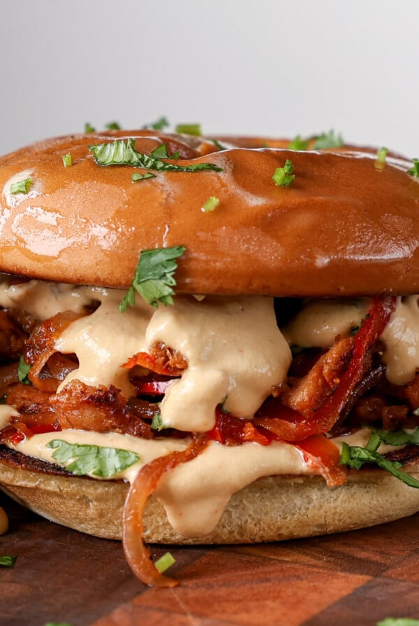 vegan cheesesteak sandwich on a cutting board