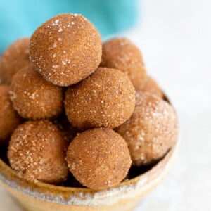 Vegan Snickerdoodle Energy Bites in a small clay bowl