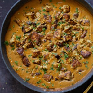 tofu barra in the pan after cooking and adding garnishes