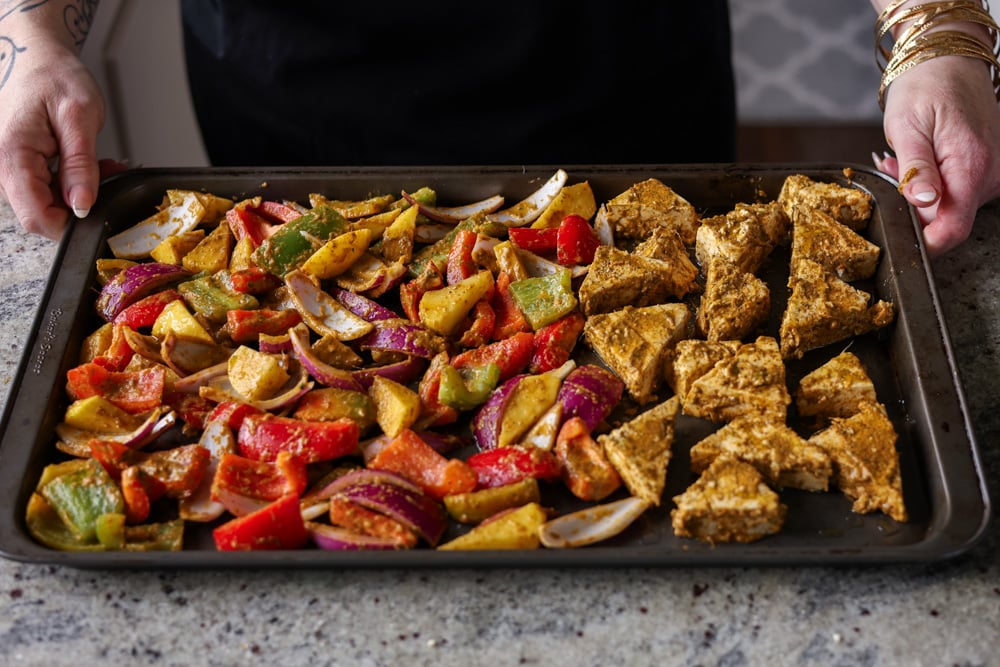 tofu and vegetables on the tray before baking