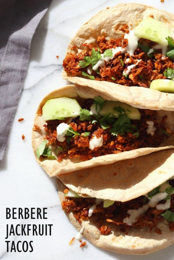 Berbere Spiced Jackfruit Tacos. Jackfruit and onion mixed with Berbere spice blend and baked to caramelized spiced perfection. Add some chickpeas to make into a hearty meal. Vegan Soy-free Nut-free Recipe, Can be Glutenfree | VeganRicha.com