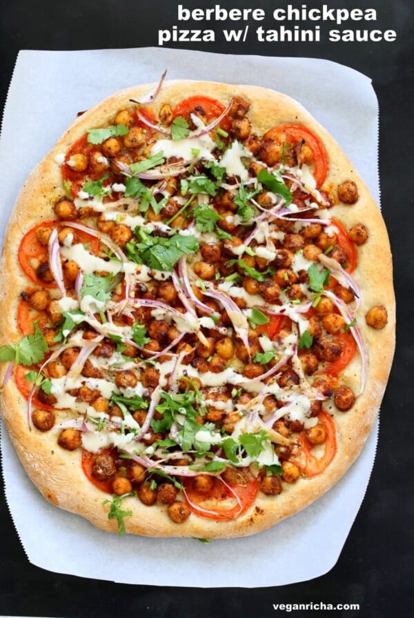 Ethiopian Berbere Chickpea Pizza with Tahini Garlic Dressing. Amazingly flavorful pizza. Dress with tahini dressing, vegan ranch or other creamy dressing. Vegan Soyfree Nut-free Recipe. Gluten-free Crust option. | VeganRicha.com