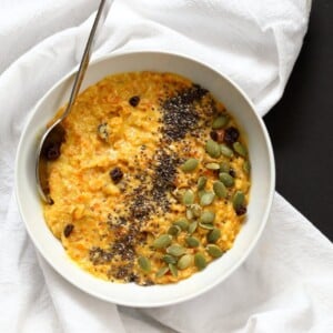 Carrot Pudding with Cardamom - Carrot Kheer Recipe. Shredded Carrots slow cooked with almond milk, roasted nuts and cardamom. Serve as is or top with toasted nuts, seeds and chia. Vegan Gluten-free Soy-free Nut-free option | VeganRicha.com