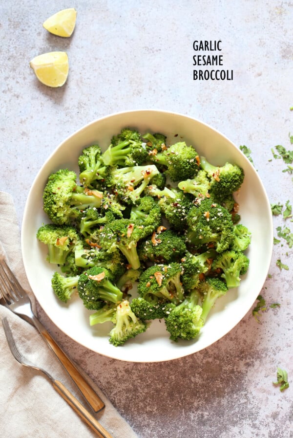 Sesame Garlic Broccoli needs just 6 ingredients. It is vibrant with blanched broccoli and delicious with a simple dressing of garlic roasted with sesame oil. A perfect side. #Vegan #glutenfree #soyfree #nutfree #veganricha #recipe 