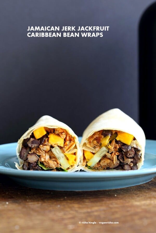 Jamaican Jerk Jackfruit Caribbean Black Bean Mango Wraps. These Burritos are packed with hot shredded jerk jackfruit, black beans, mango and cucumbers. Serve as wraps or make a sandwich or bowl. Vegan Soy-free Recipe. Can be gluten-free | VeganRicha.com #vegan #glutenfree #veganricha