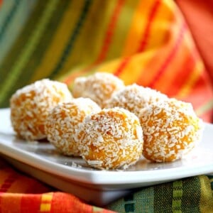 Mango Coconut Ladoo. Fudgy Mango balls made with Mango Puree, Coconut and almond meal. Vegan gluten-free recipe. Easy soy-free dessert or snack. | VeganRicha.com #glutenfree #veganricha #vegan