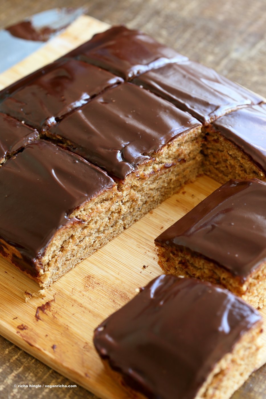 sliced peanut butter cake on a cutting board