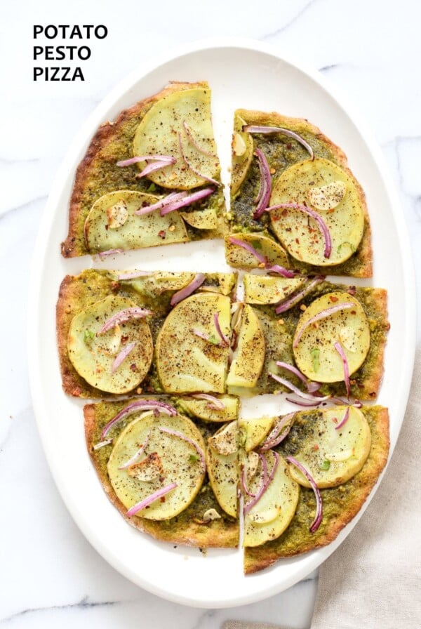 Easy Potato Pesto Pizza with Thin Crust. Basil Spinach Pesto makes for a refreshing Pizza base topping with thin potato slices, onion and garlic. Bake or make on the grill. Vegan Soyfree Recipe. | VeganRicha.com #glutenfree #veganricha #vegan