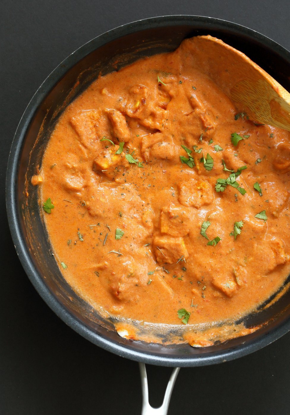 Indian Butter Tofu in Black Skillet over black board