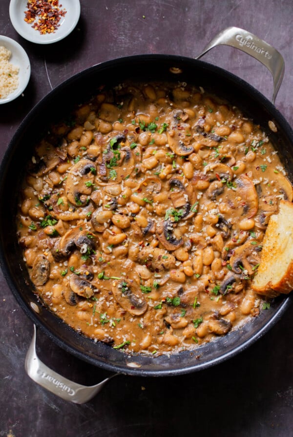 white bean stroganoff in the pan with toast